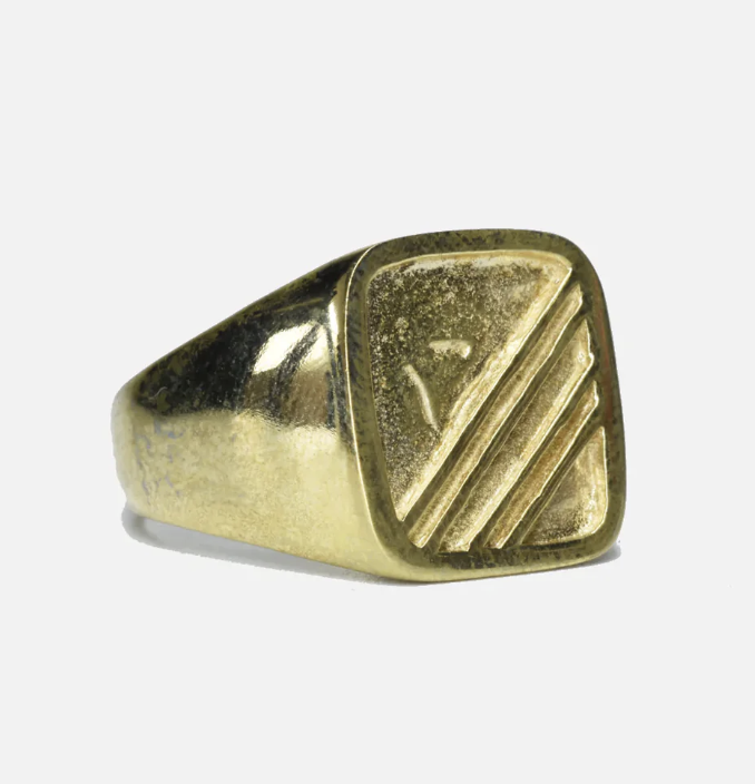 Gold ring with flat face and some ridges