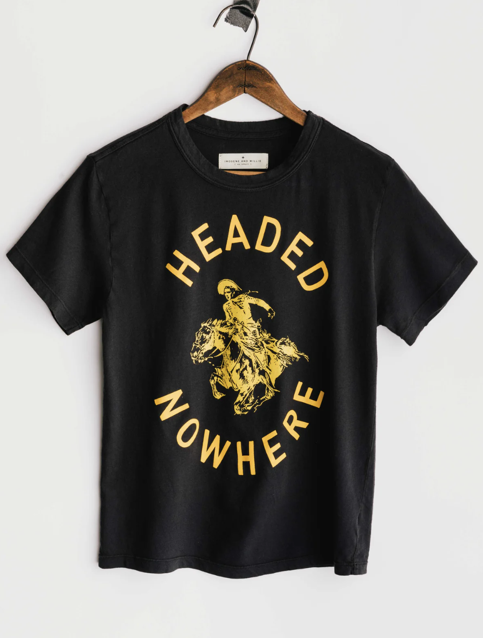 Black t-shirt on a hanger that says headed nowhere with an image of a cowboy in the center