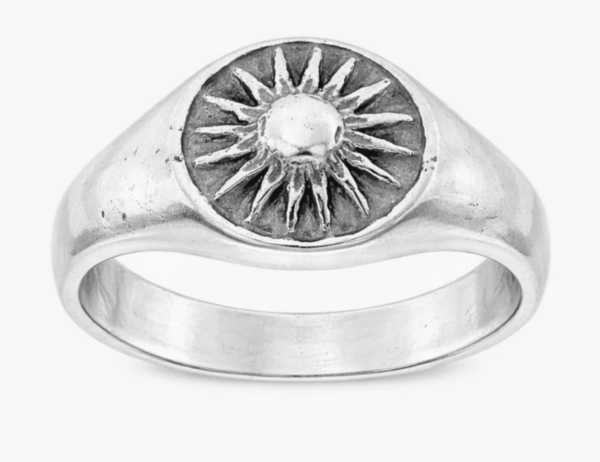 A signet ring with a sun on it
