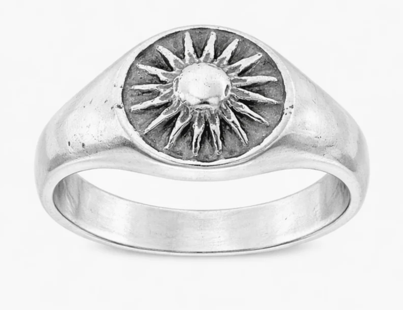 A signet ring with a sun on it